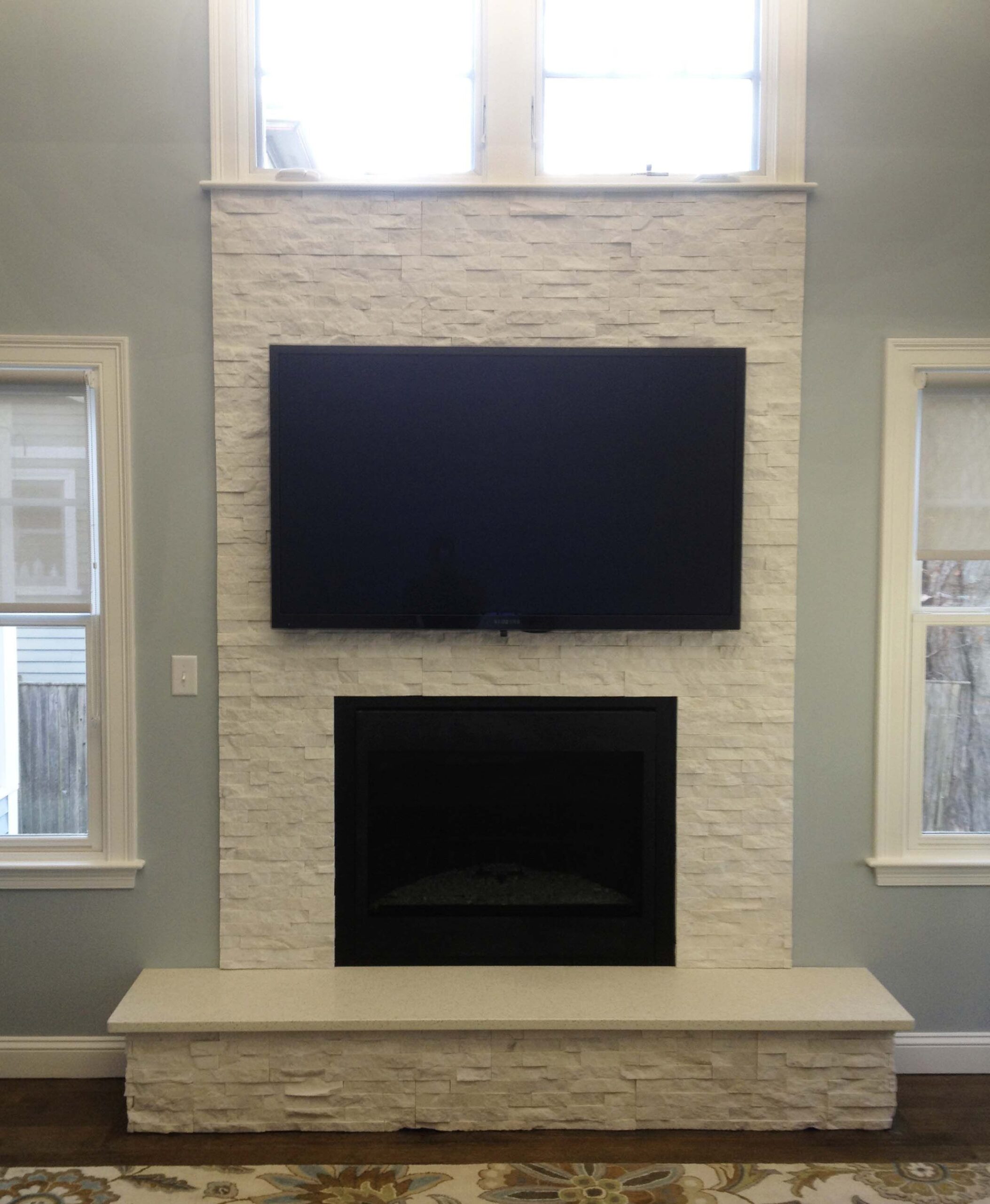 astonishing white stone fireplace | finished nor stone fireplace with mounted tv in mounting tv above gas fireplace picture