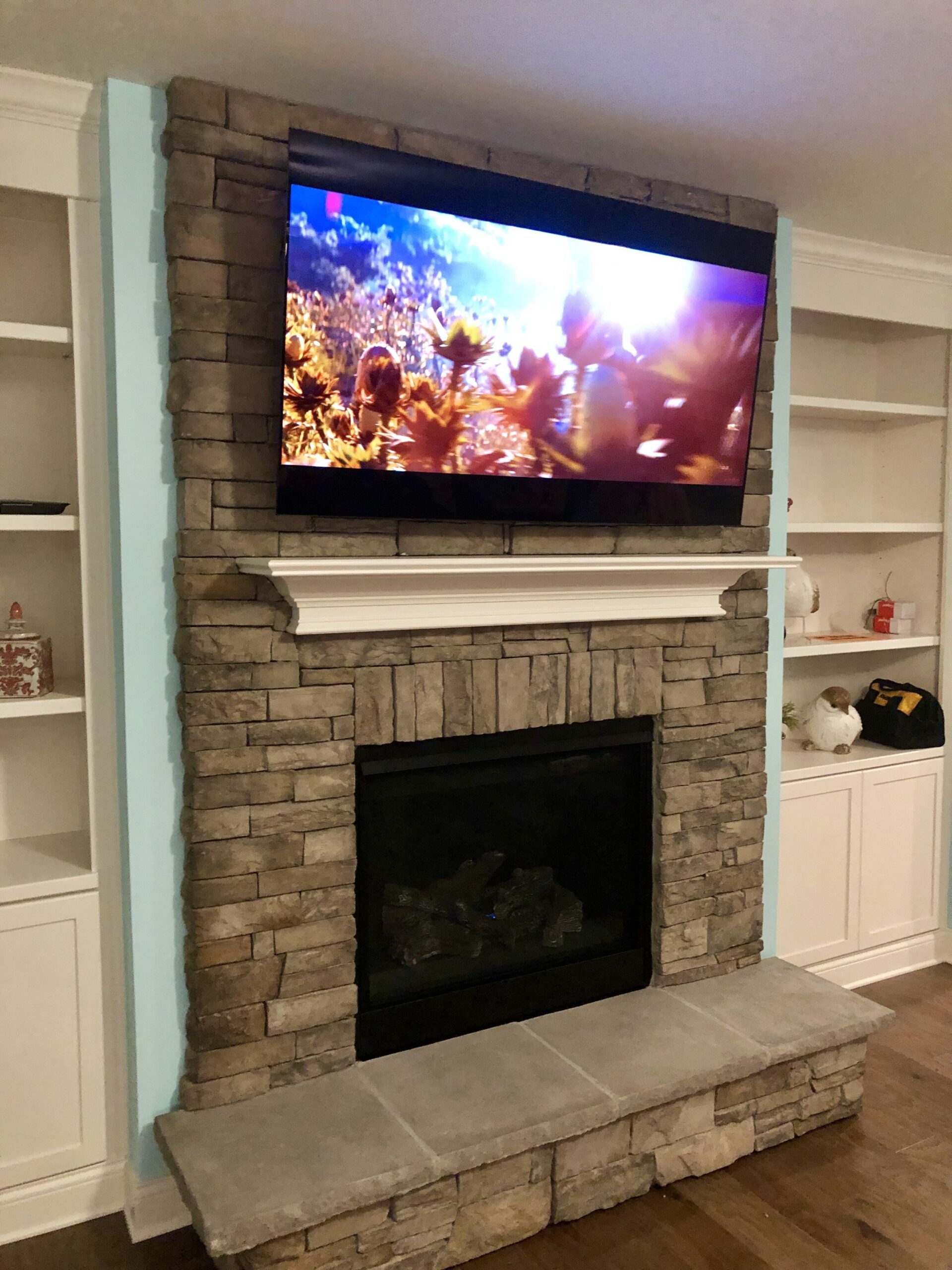 get lowes rock fireplace tv installation in georgetown, ky • lg 65" oled mounting tv above gas fireplace image