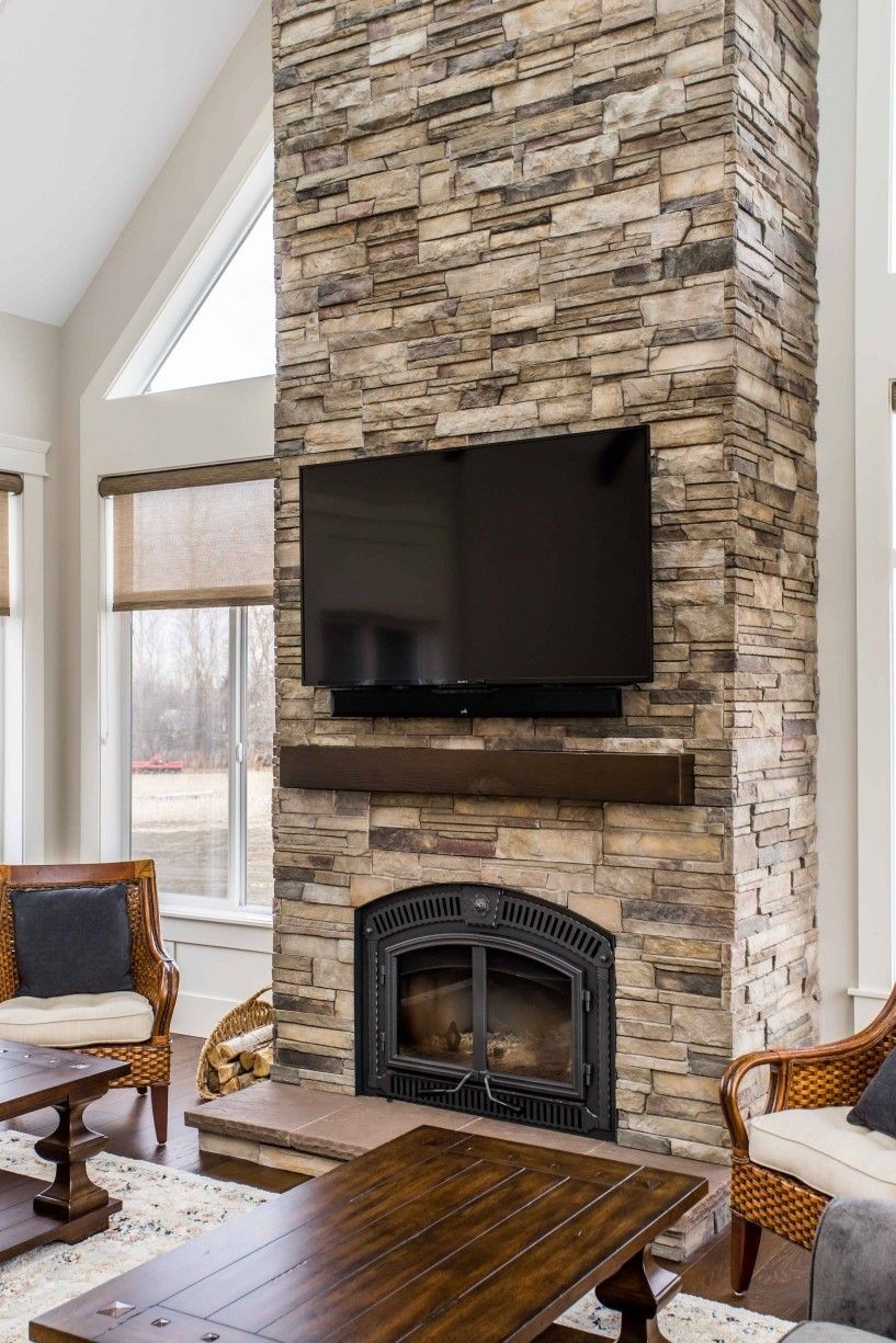 inspiring pindevin chobanik on acreage | fireplace tv wall, exterior stone tv mounted on stone fireplace image