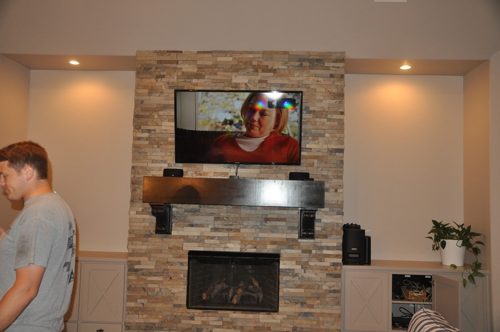 lowes made: how to mount a flat screen tv on a stone fireplace {diy} can you wall mount a tv over a fireplace image