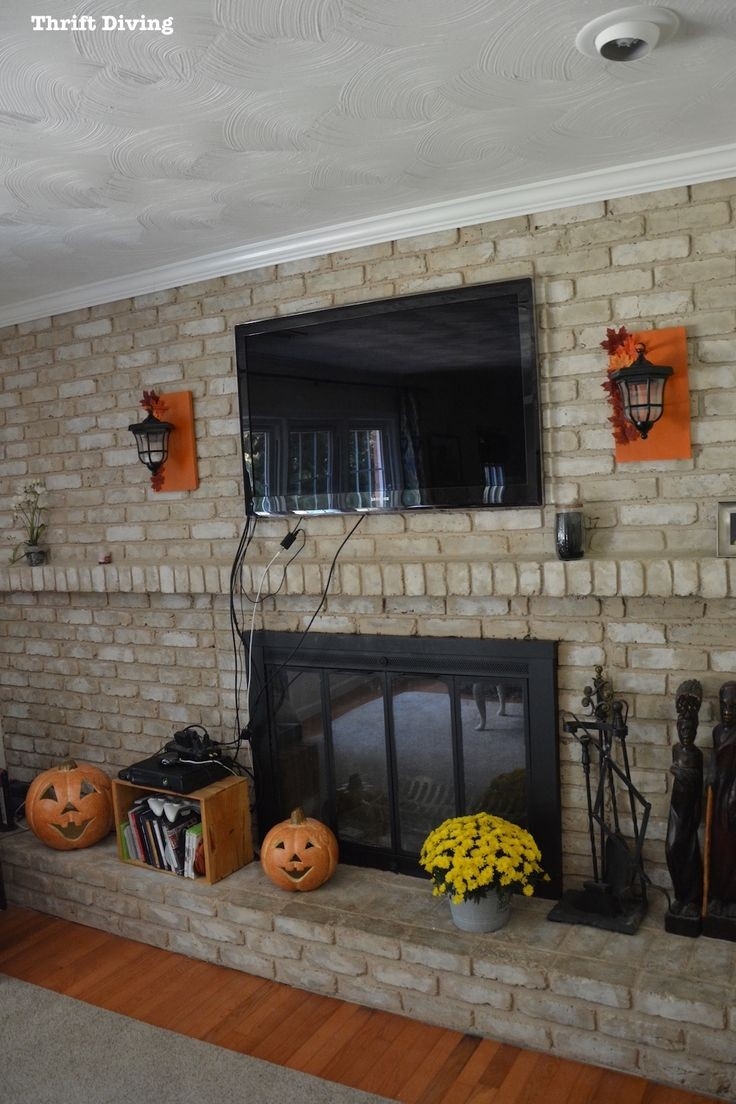 picture of diy lanterns upcycled from thrifted path lights | brick fireplace sponge painting brick fireplace photo