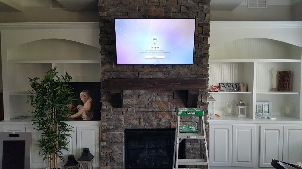 wonderful flat panel tv mounted over a stone fireplace in greenville sc (2 flat screen tv mounted over fireplace image