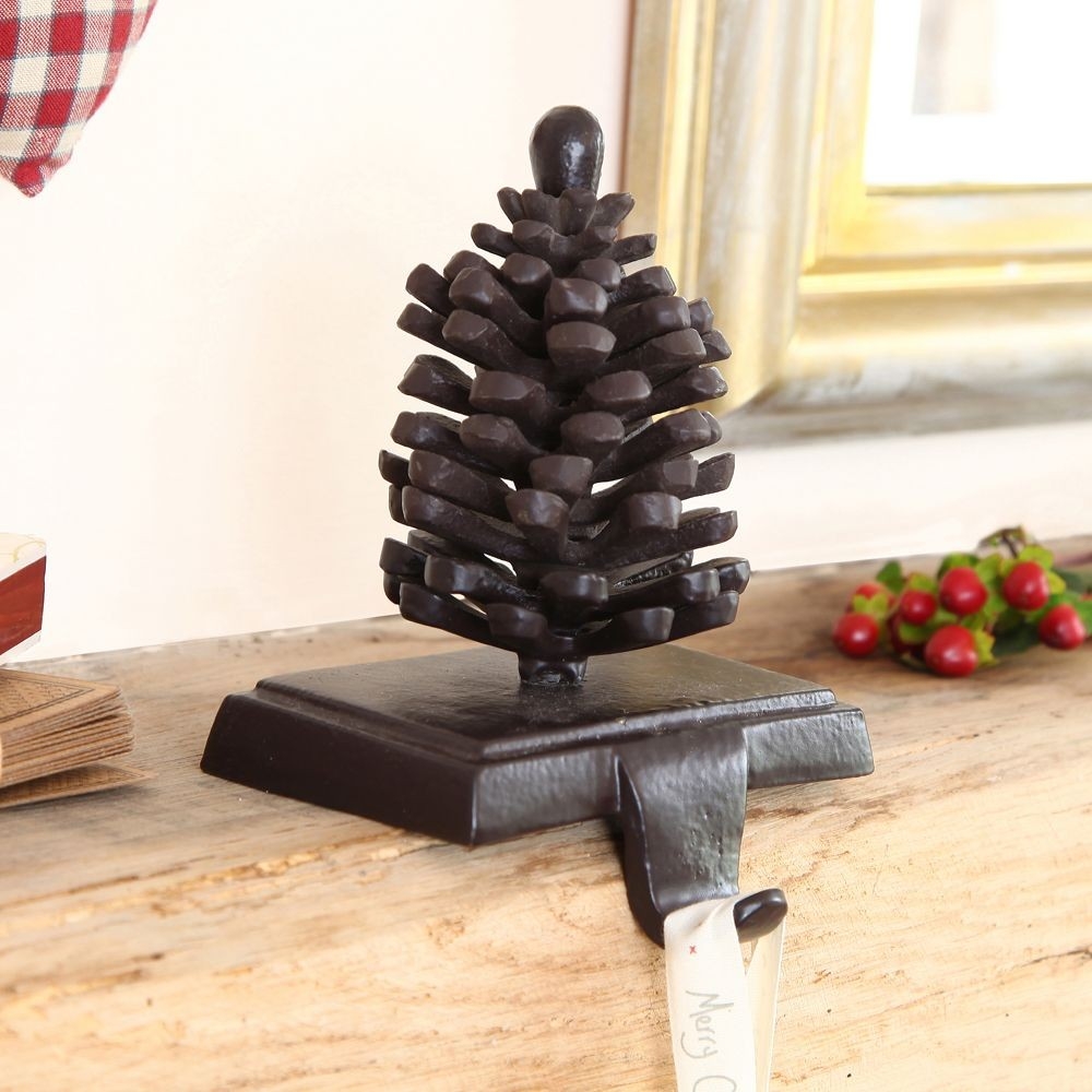 awesome cast iron pine cone stocking holder | christmas stocking holders christmas stocking holders for fireplace pics