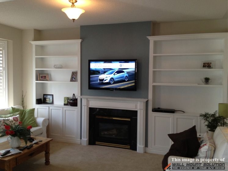 awesome tv wall mount installation with wire concealment over fireplace | hide hide tv cords over fireplace image