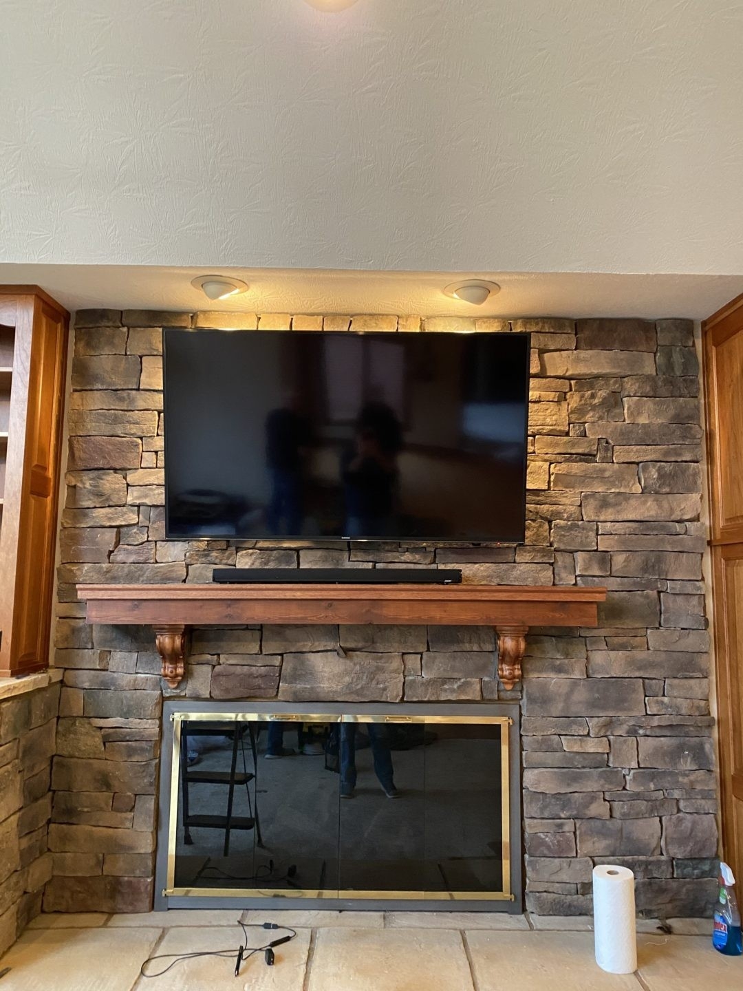 buy fireplace tv hanging | remote consolidation | indoor audio/visual hang tv above brick fireplace image