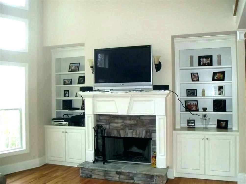 buy hide tv over fireplace thestark co | freestanding fireplace, tv above ways to cover a fireplace pics