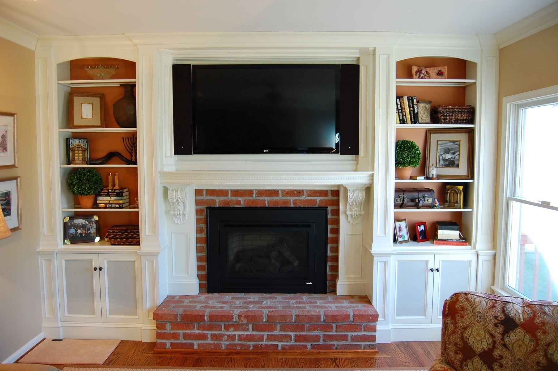 get lowes over mantel tv cabinetry | tv over fireplace, fireplace shelves, home hanging a tv on brick fireplace image
