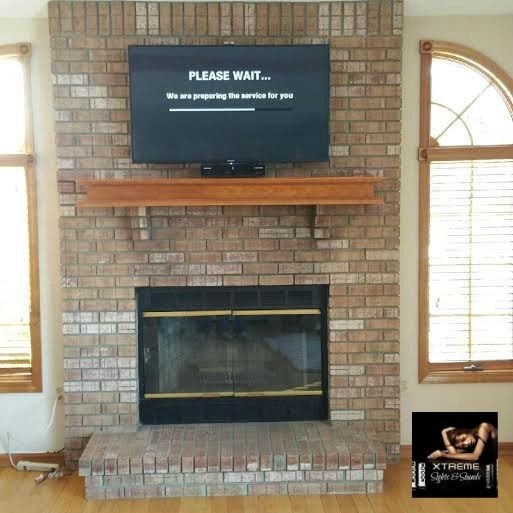 good tv mounted to brick fireplace, nj #brick #tvmounting #nj #decor # how to hide tv wires over brick fireplace image