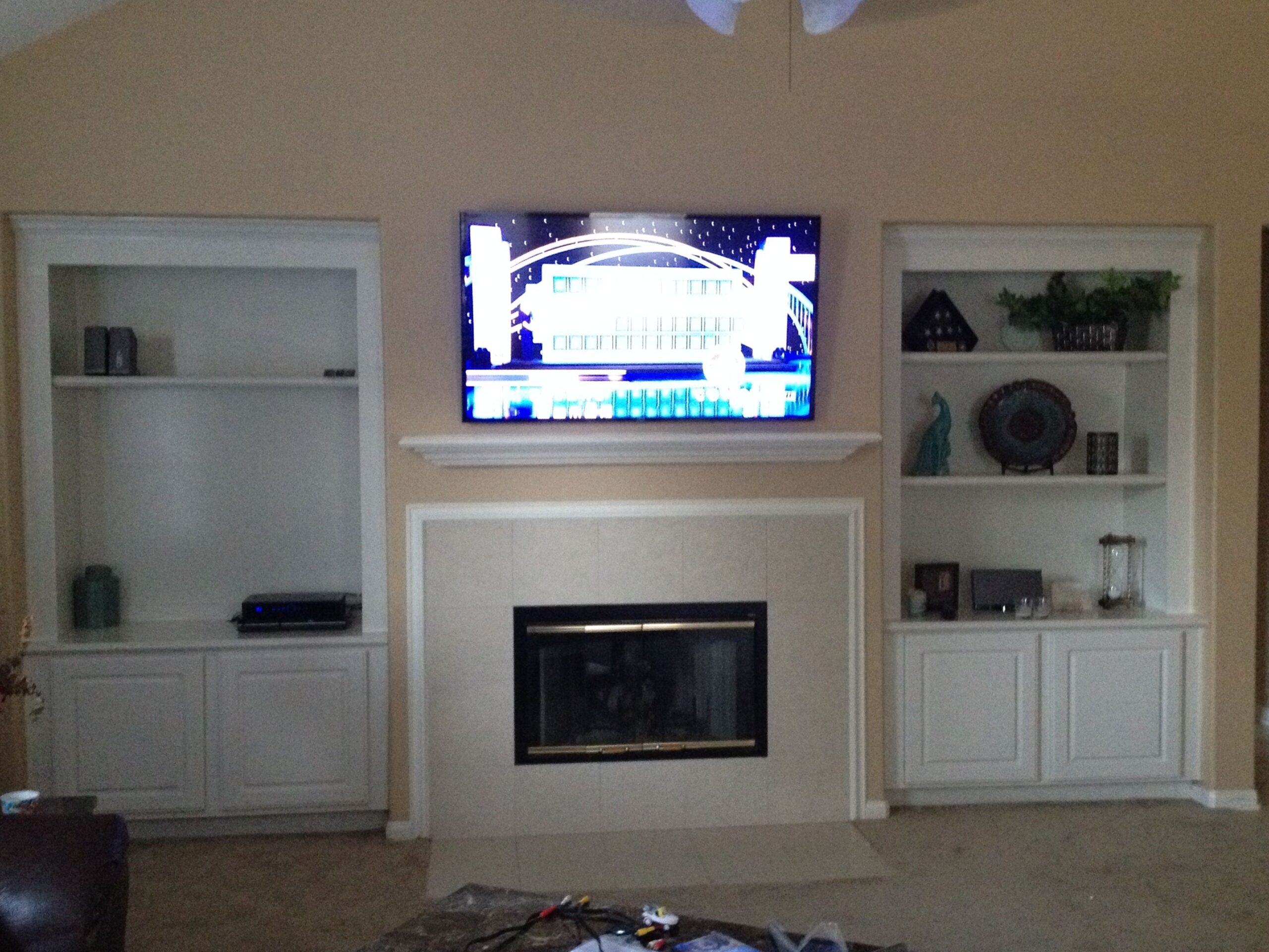 image of tilt mount tv installation over fireplace | tv installation, home how to install tv over fireplace image