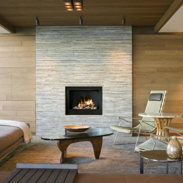 inspiring 5 natural stacked stone installs for the modern aesthetic | stone fireplace hearth ideas contemporary picture