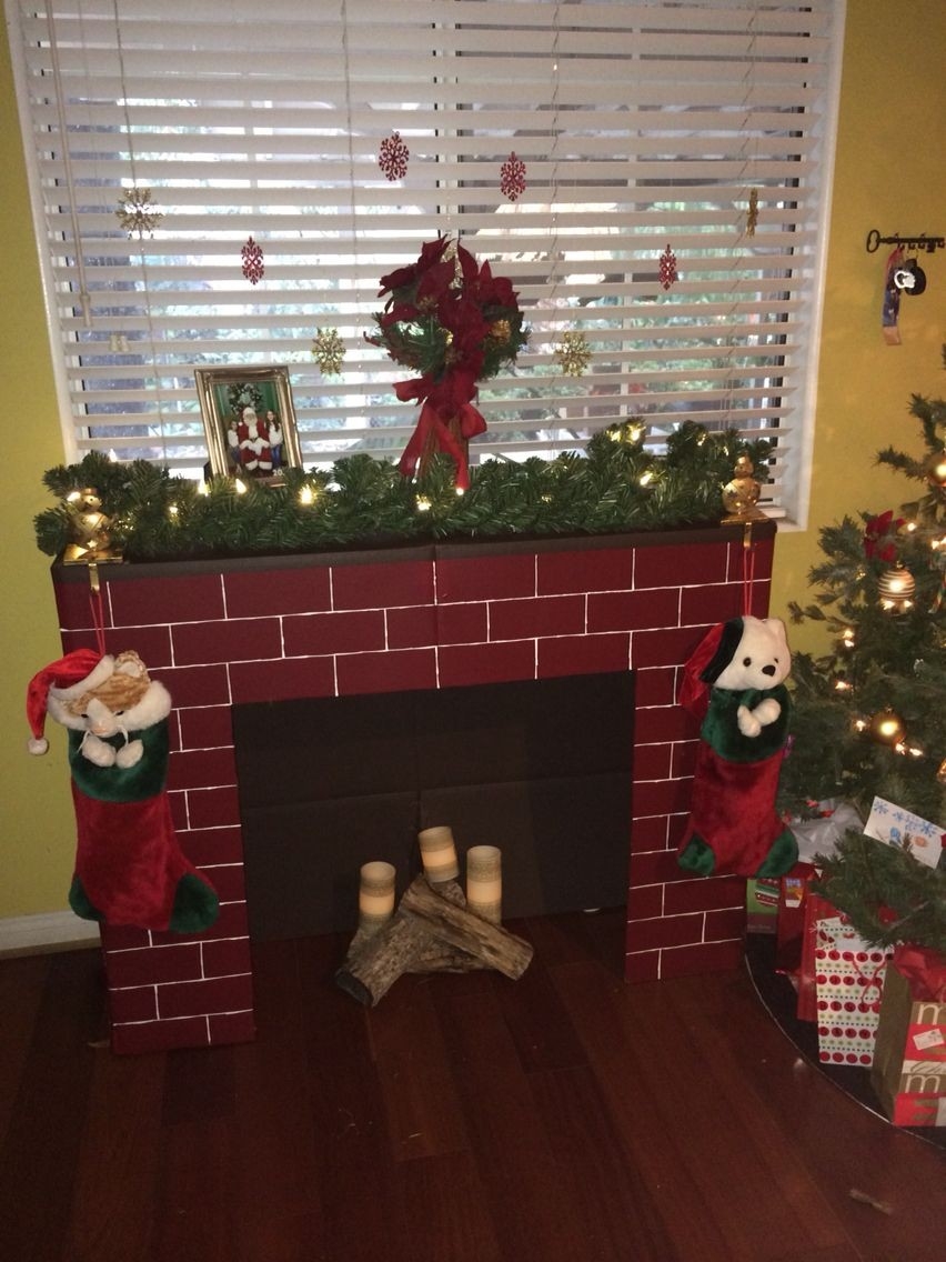 lowes cardboard fireplace … | diy christmas fireplace, holiday crafts christmas corrugated fireplace brick paper pics