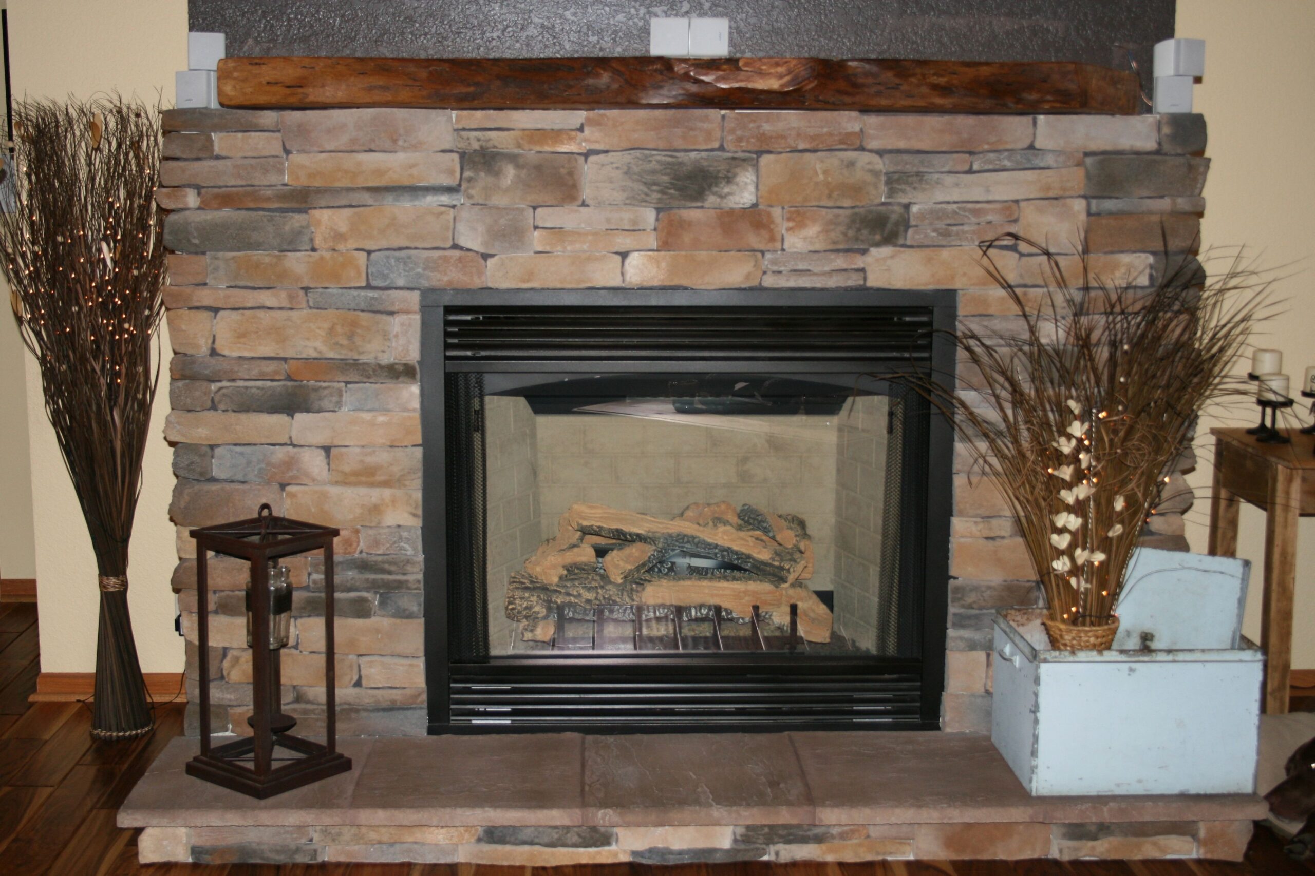 marvelous stacked stone fireplace with tree trunk mantle | stacked stone stacked stone around fireplace photo