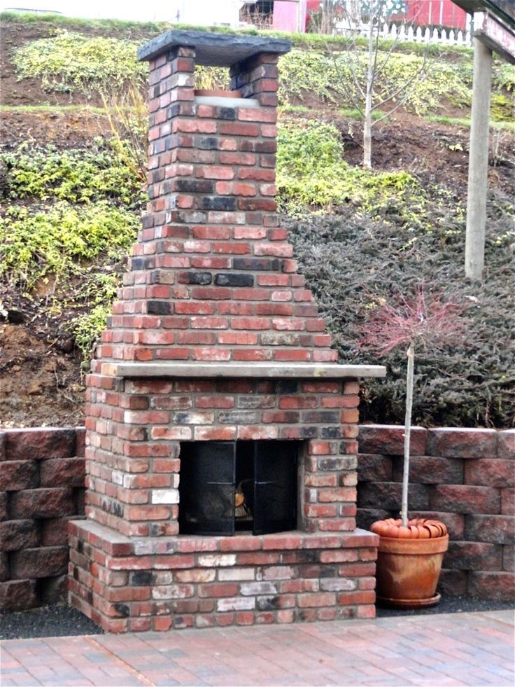 outstanding the new outdoor fireplace! | outdoor fireplace brick, backyard diy outdoor brick fireplace image