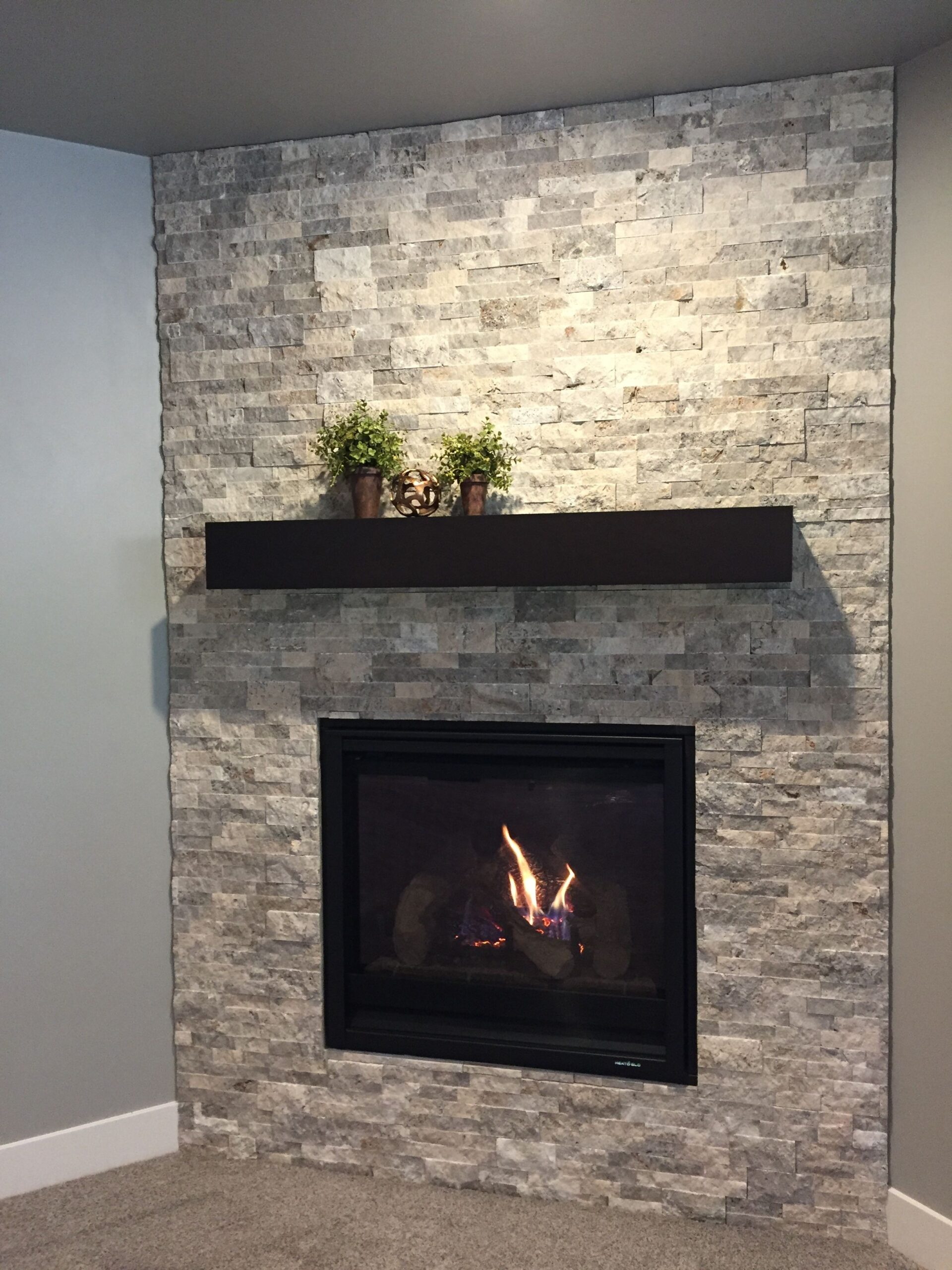 remarkable corner fireplace with silver travertine stacked stone surround and box slate tiles for fireplace surround pics