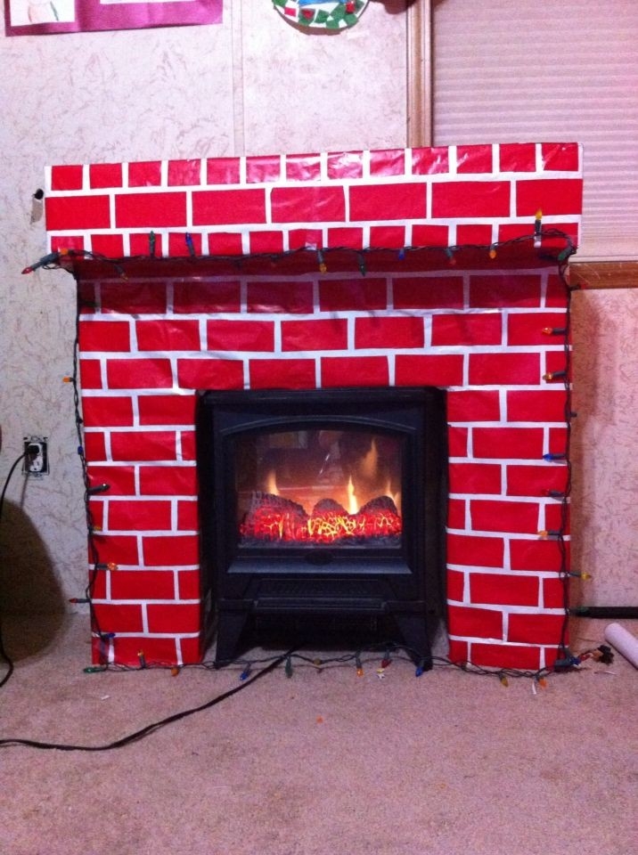 stylish our cardboard fireplace just in time for christmas | cardboard christmas corrugated fireplace brick paper photo